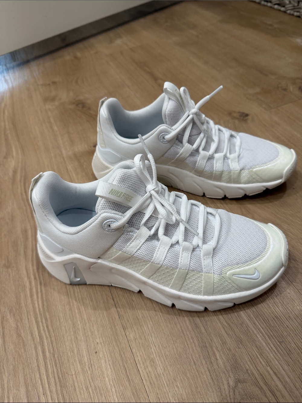 Nike Women's White Mesh Athletic Sneakers with Subtle Silver Swoosh
